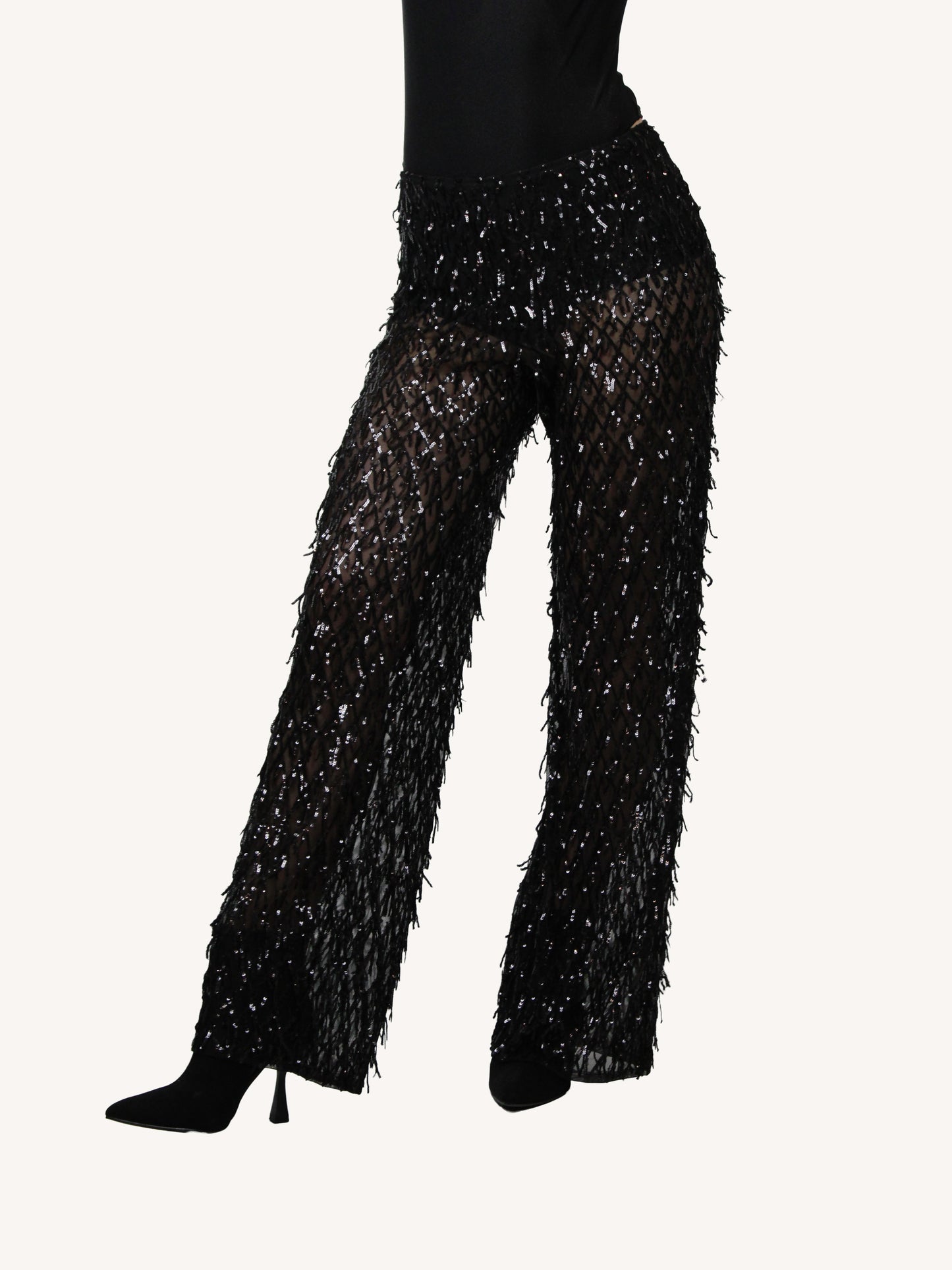 Pantalone trasparente in tessuto ricamato con frange di paillettes